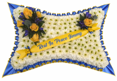 Blue and Yellow Pillow - A classic Pillow shaped design created using a mass of white double spray chrysanthemums and finished with a spray of Yellow roses and finished with a double pleated Blue and Yellow ribbon trim.