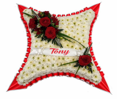 Cushion - Red & White - A cushion-shaped design created using a mass of white double chrysanthemums and finished with a spray of red roses and finished with a double pleated red and white ribbon trim.