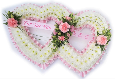 Double Heart - Pink and white - A double heart-shaped design with a mass of white double chrysanthemums and edged in Pink and white pleated ribbon finished with a spray to match by Alison's designer florist