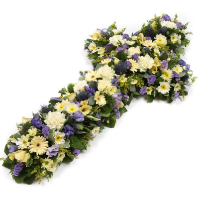 Lilac and Cream Cross - A Lilac & Cream Cross with a mass of flowers in lemon and blues including roses, spray carnations, spray chrysanthemums and statice by Alisons designer florist